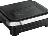 a close up of a black and silver sandwich maker on a white background