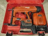 a red tool box with tools in it on the floor