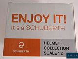 a box that has a sign on it that says enjoy it it ' s a schuberth