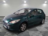 a picture of a green car parked in a garage