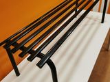 an image of a bench made out of metal bars