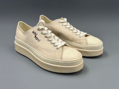 a pair of white sneakers with the word hell on them