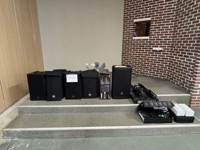 a bunch of electronics sitting on the steps of a building