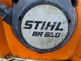 a close up view of a stihl breq logo on the front of a chainsaw