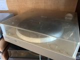 a turntable sitting on top of a stack of boxes