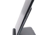 a cell phone that is sitting on top of a stand