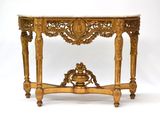 une table console en or avec un plateau en marbre