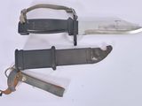 two knives that are laying next to each other on a table