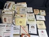 many different types of wine labels laid out on a table