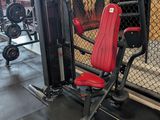 a gym room with a bench, weights, and other equipment