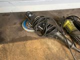 an image of a corded corded device laying on the floor