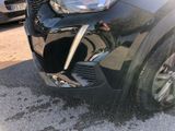 a close up of a car ' s front grill and front bumper