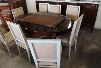 a dining room table with six chairs around it