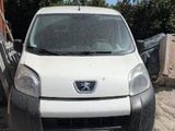a white van that is parked in the dirt
