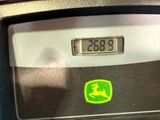a close up of a clock on the side of a parking meter
