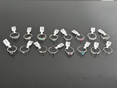 a lot of rings that are sitting on a table