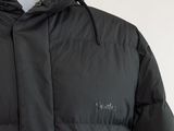 the jacket is black and has a hood that is attached to it