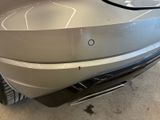 a close up of a car ' s front bumper