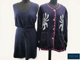pair of women ' s dresses on a mannequin stand with a white background
