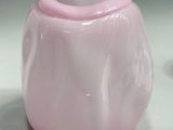 two pink vases that are sitting on a table