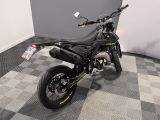 a picture of a motorcycle parked on a checkered floor