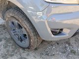 a close up of the front end of a silver truck