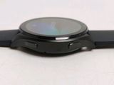 a close up of a smart watch on a white surface