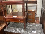 a dresser with a marble top in a room