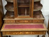 a small desk with a mirror on top of it