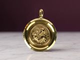 an image of a gold locke with a picture of a woman on it