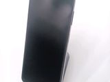 a cell phone that is sitting on top of a stand