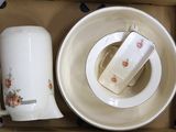 a box with a cup and a plate inside of it