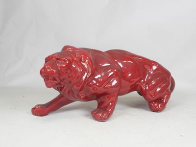 red ceramic figurine of a dog on a white background