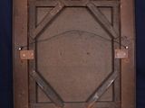 an old wooden picture frame with a square design on it