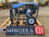 a picture of a small engine on a pallet in a warehouse