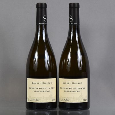 two bottles of wine sitting on top of a table next to each other