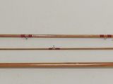 three different types of fishing rods are lined up on a white surface