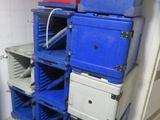 many blue and red boxes stacked on top of each other