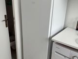 an image of a kitchen with a washer and dryer