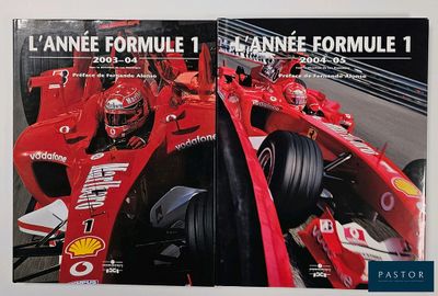 two books on a table with a picture of a race car
