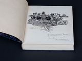 an open book with a drawing of a group of people on it