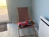 a chair that is sitting in front of a radiator