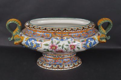 a large vase that has a handle on it