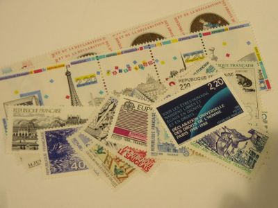 a lot of stamps that are on the table