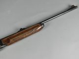 the rifle is laying on the table ready to be used