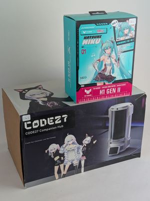 two boxes of action figures sitting on a table