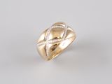 a gold ring with diamonds on a white background