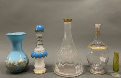 several glass vases and vases are lined up on a gray surface