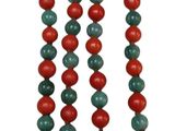 a close up of a red and green beaded necklace on a white background