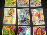 the pokemon cards are lined up on a table